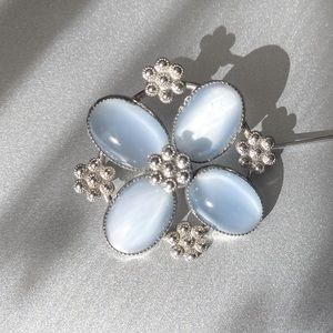 Vintage “AMCO” Blue 
Moonstone Glass Pin w/ Sterling Rosettes set in Sterling 🩵